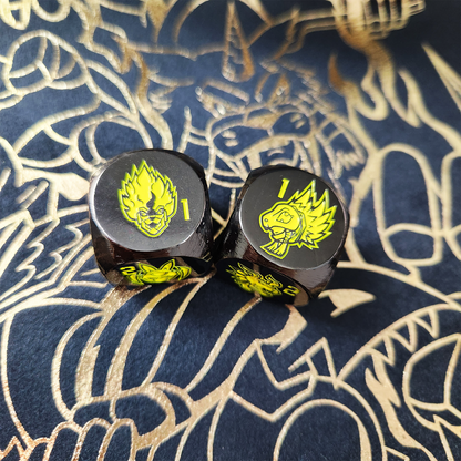 Set of 2 dice with 12 different characters on each side, engraved on black metal plating.