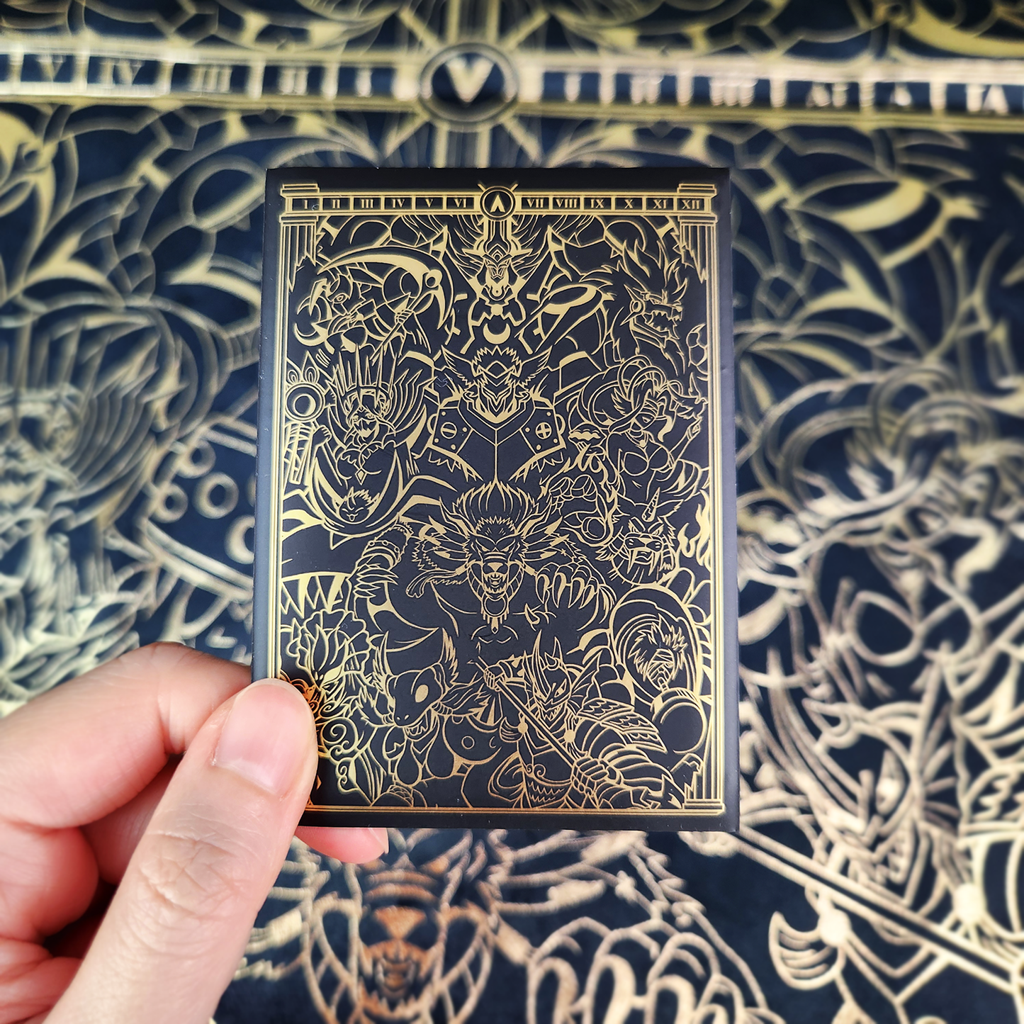 Realm of Gods sleeves with gold foil on black.