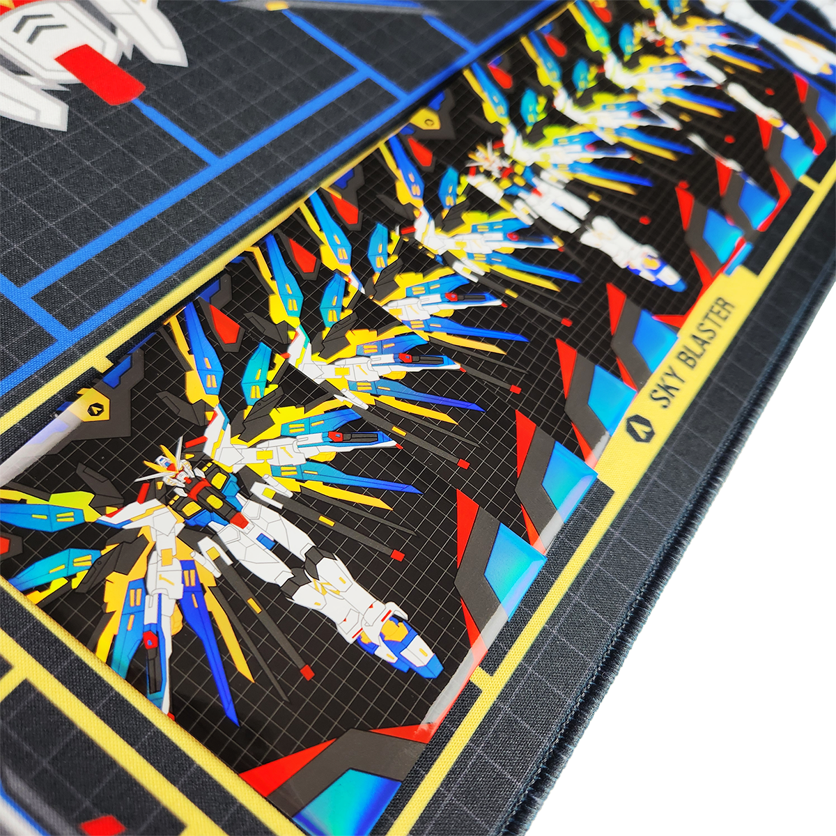 Close-up of Sky Blaster sleeves on a matching  gaming playmat featuring a sci-fi mecha artwork, with a black grid background, and blue tactical lines.